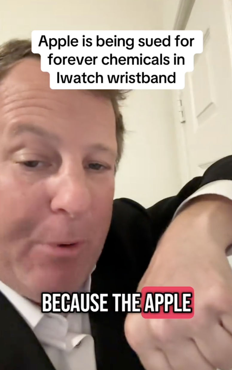 man in a suit talking to a camera